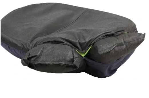 Close-up of a dog bed with zippered cover being opened — washable upholstery detail showing how the cover can be removed for cleaning