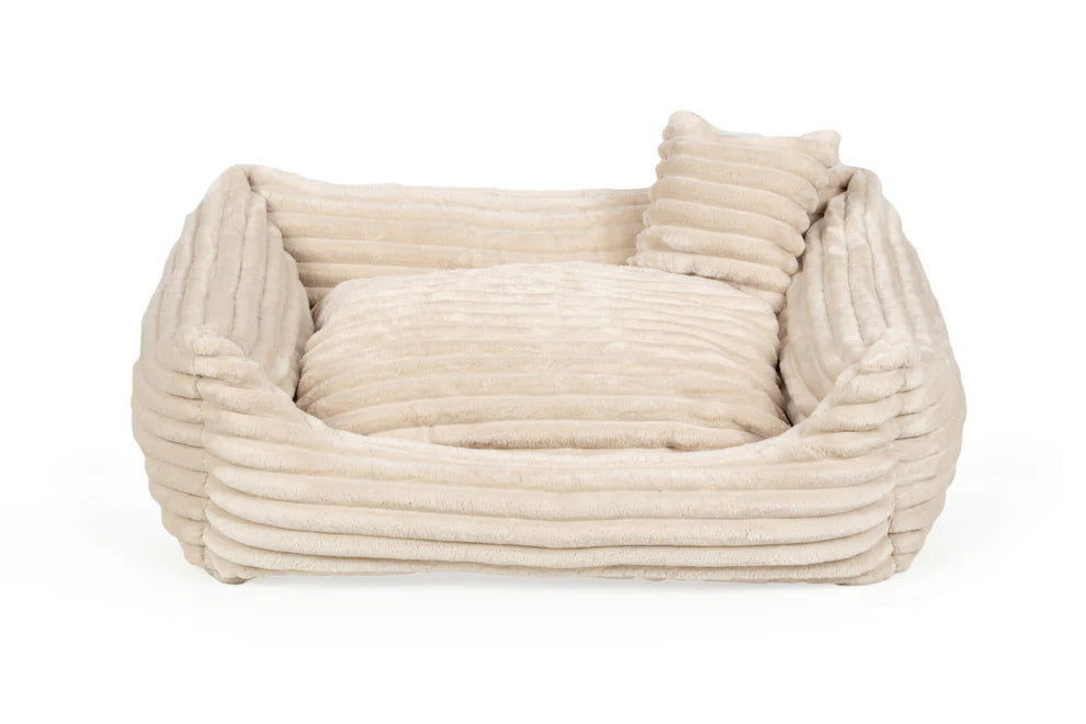 Cream plush dog bed with ribbed texture and shredded foam filling — Dream model, soft-touch fabric, machine washable, and ideal for dogs who love to snuggle
