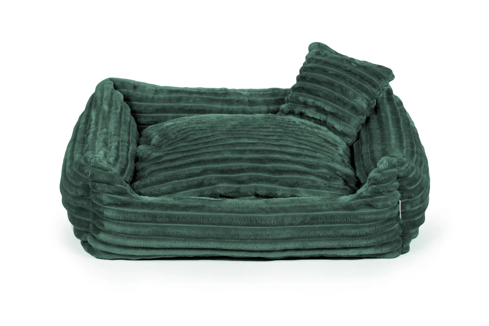 Green plush dog bed with ribbed texture and shredded foam filling — Dream model, soft-touch fabric, machine washable, and ideal for dogs who love to snuggle