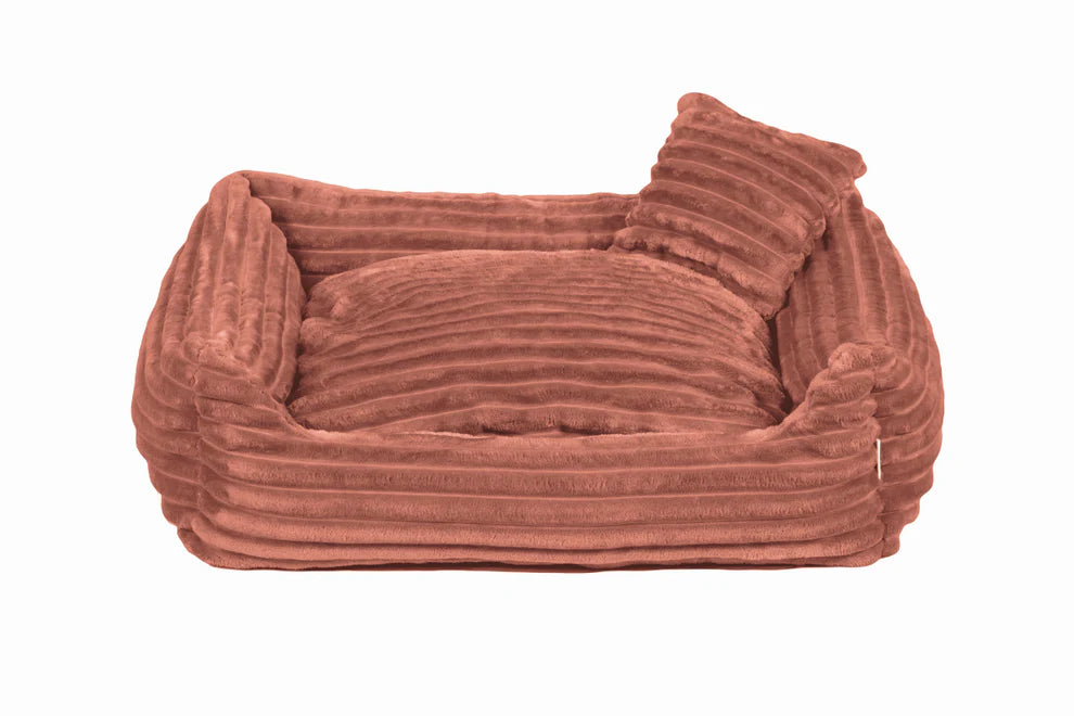 Peach plush dog bed with ribbed texture and shredded foam filling — Dream model, soft-touch fabric, machine washable, and ideal for dogs who love to snuggle