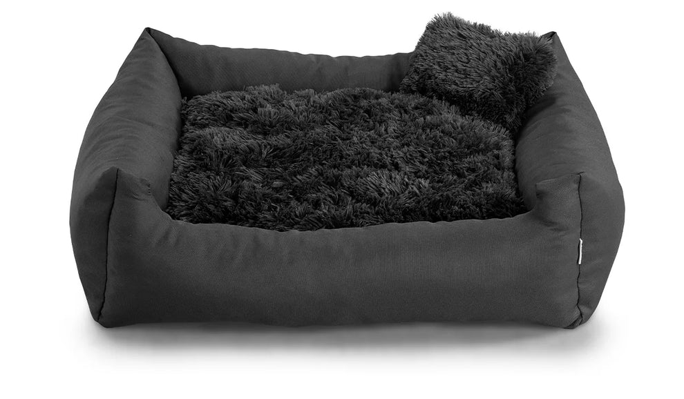 Fluffy Nelo dog bed in dark grey colour fabric with small pillow.