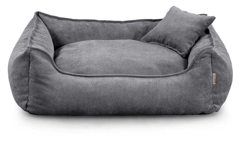 Close-up of Lucky dog bed in dark grey corduroy fabric, showing zippered cushion and durable stitching