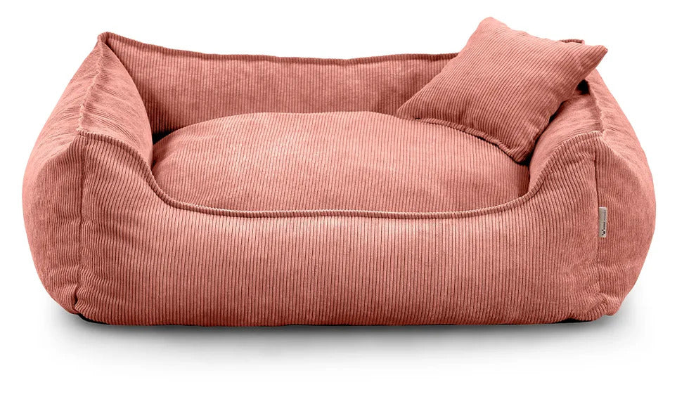 Close-up of Lucky dog bed in peach corduroy fabric, showing zippered cushion and durable stitching