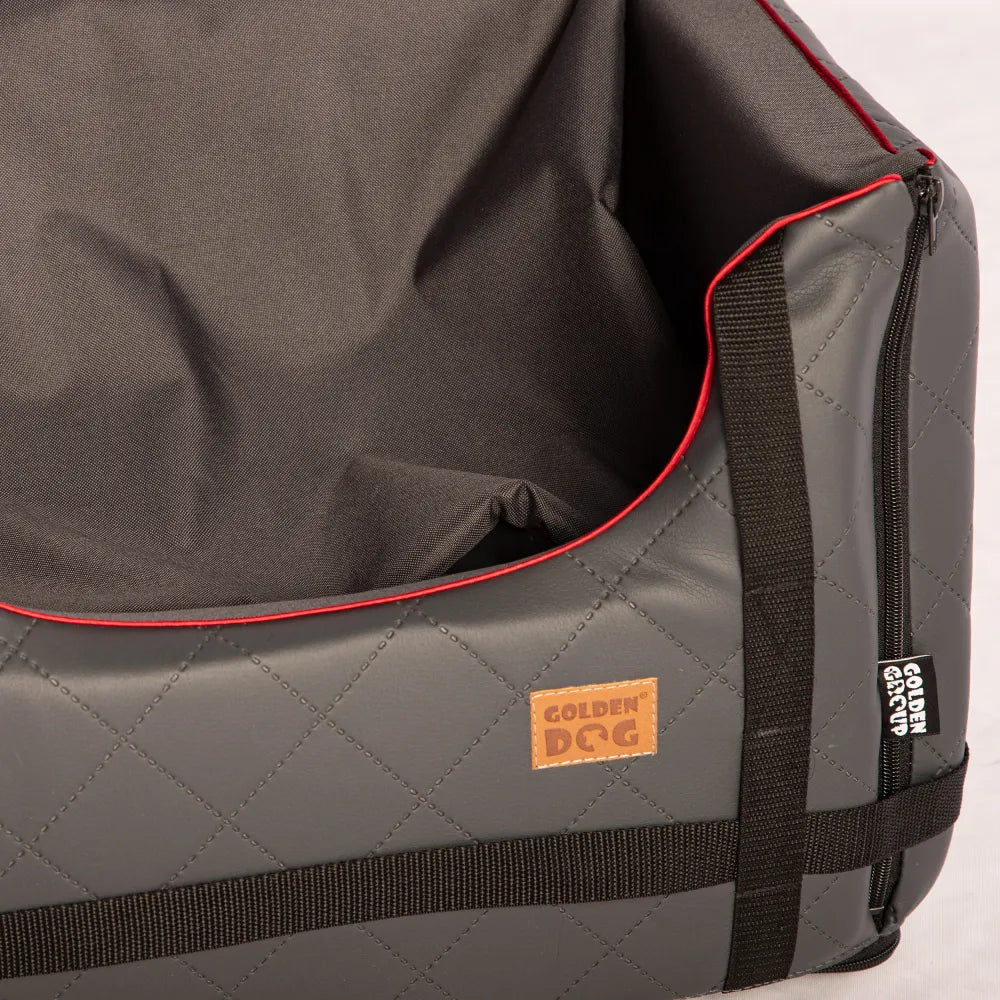 Stylish grey quilted dog car seat with red piping, Golden Dog logo patch and embroidered paw print — securely fastened for comfortable car trave