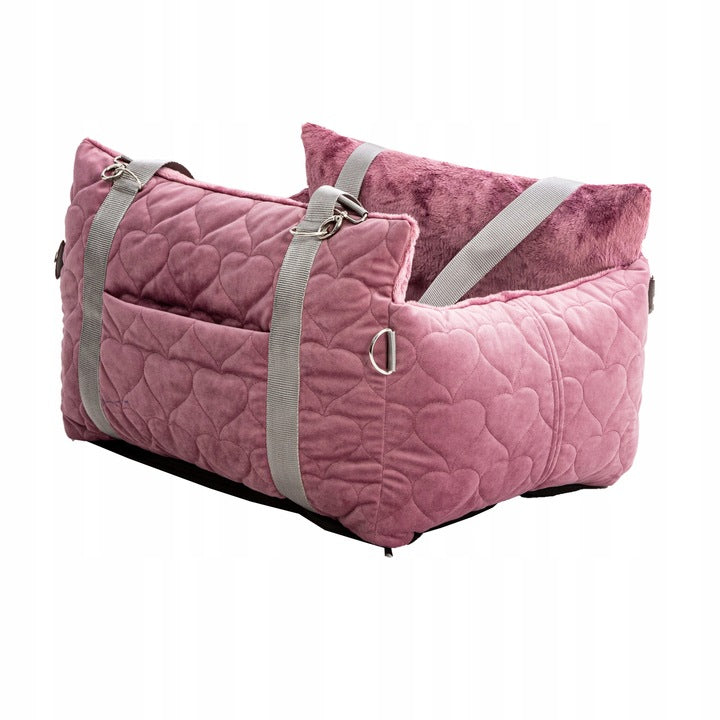 Pink quilted pet car seat and carrier from Golden Dog, featuring cosy interior padding, webbed handles, and headrest strap for secure travel with small dogs.