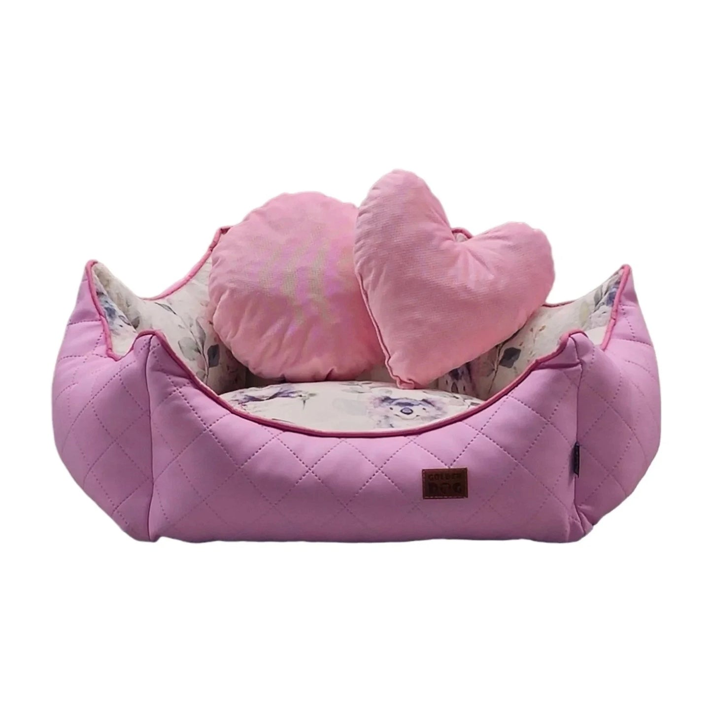 Pink princess dog bed with quilted surface, heart and round pillows, and floral inner lining — elegant pet bedding for comfort and charm