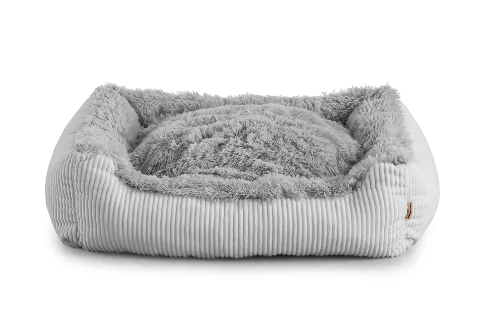 Shaggy dog bed in grey colour fabric with small pillow.