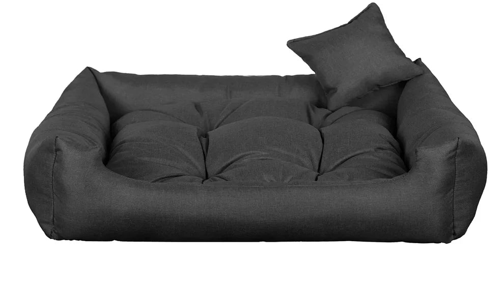 Dark grey dog bed with thick cushion and raised sides, made from water-resistant, scratch-resistant upholstery — Sleepy Cora model for dogs of all sizes