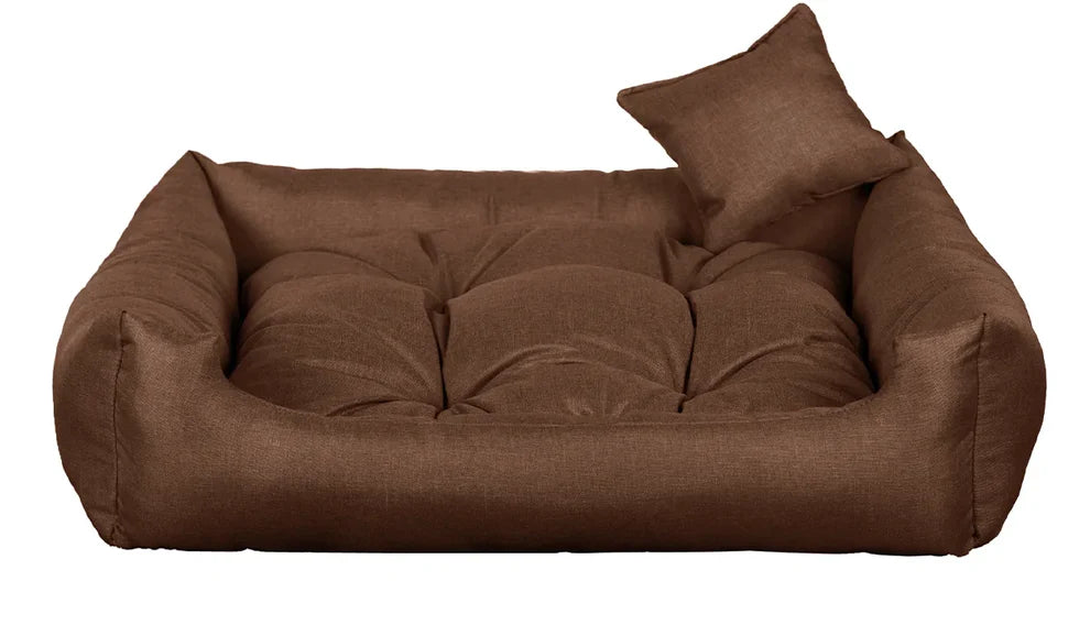 Light brown dog bed with thick cushion and raised sides, made from water-resistant, scratch-resistant upholstery — Sleepy Cora model for dogs of all sizes