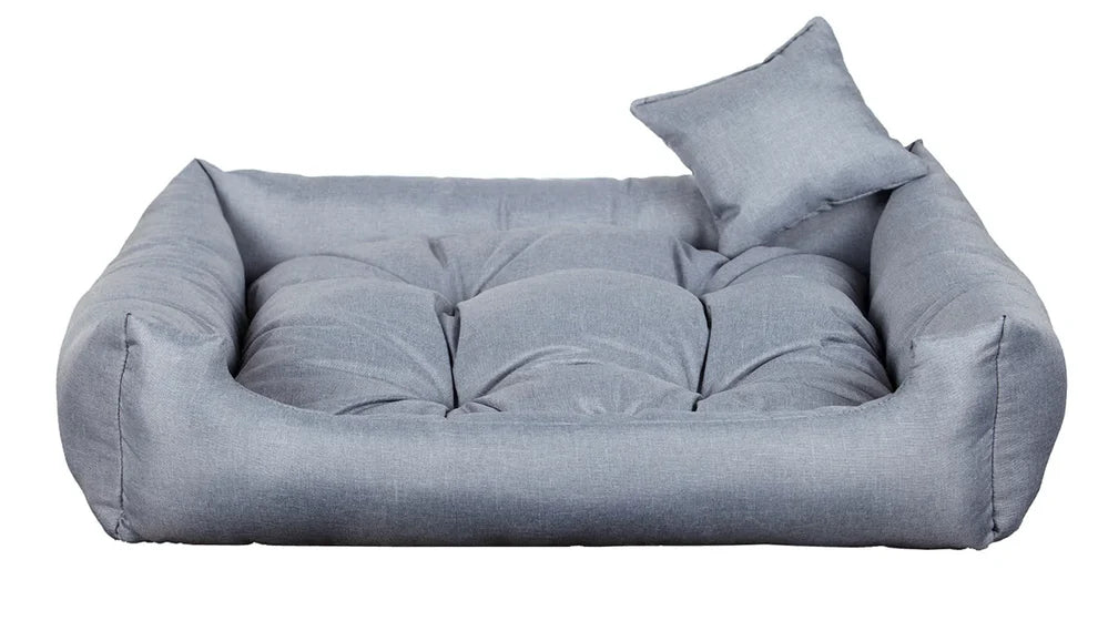 Light grey dog bed with thick cushion and raised sides, made from water-resistant, scratch-resistant upholstery — Sleepy Cora model for dogs of all sizes