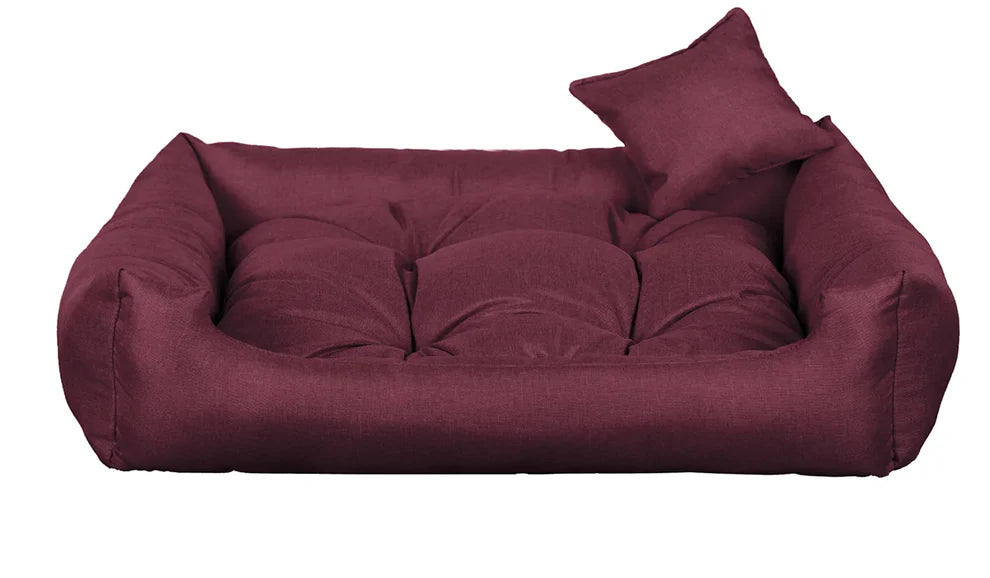Purple dog bed with thick cushion and raised sides, made from water-resistant, scratch-resistant upholstery — Sleepy Cora model for dogs of all sizes
