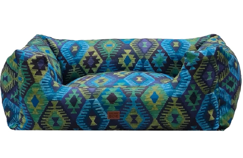 Sofa-style dog bed with aztec pattern featuring raised sides for comfort and decorative elegance