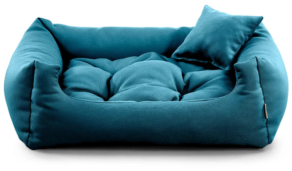 Cosy dog bed in turquise colour.