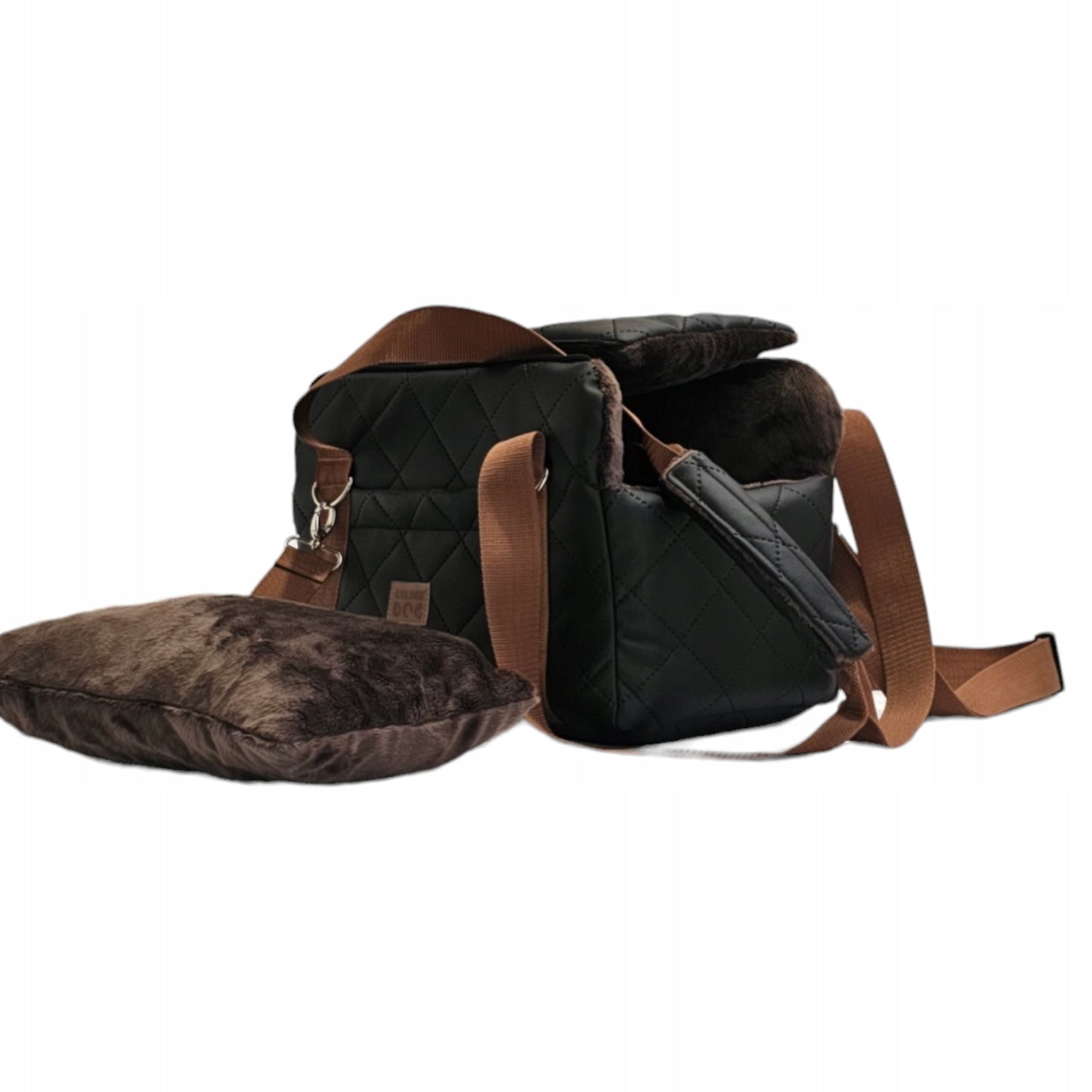 Black quilted dog travel bag with brown shoulder straps and soft plush interior; labelled “Deluxe Dog” — a stylish and secure pet carrier for small breeds.