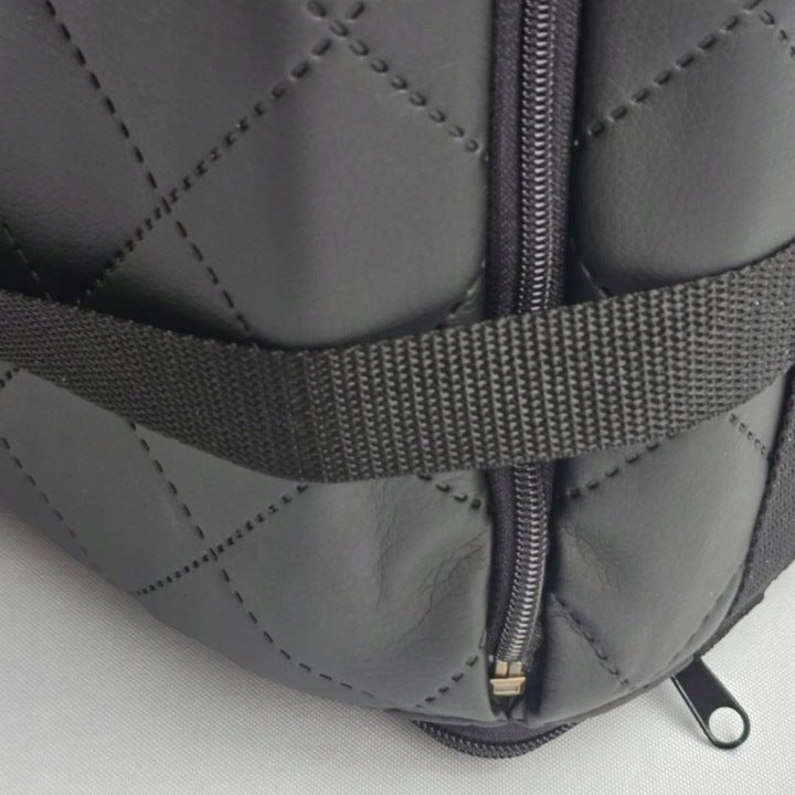 Black quilted dog car seat cover ; includes adjustable securing straps and fits standard car seats — a protective travel accessory for pet owners.