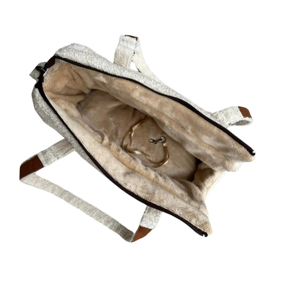 Stylish cream teddy fabric handbag with soft lining, brown handles and a practical front pocket – perfect for cosy autumn and winter outings.