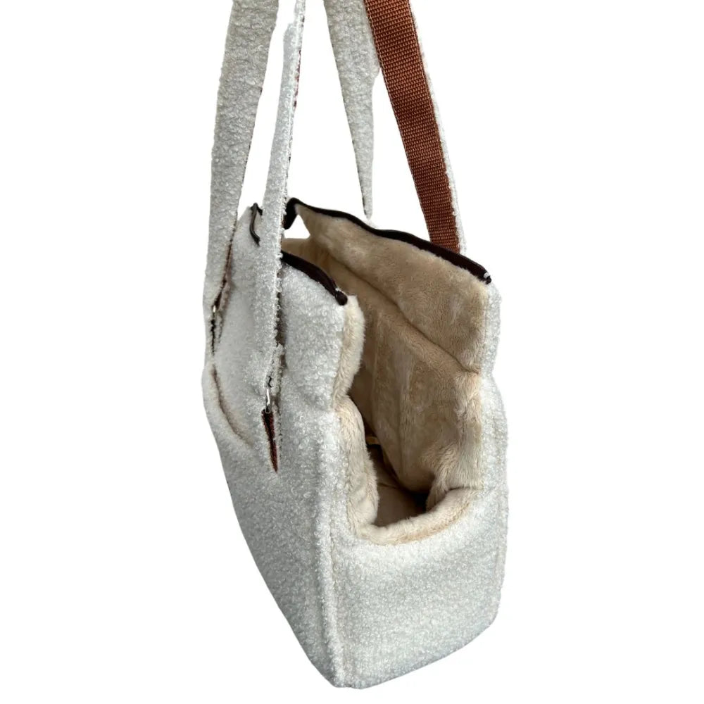 Stylish cream teddy fabric handbag with soft lining, brown handles and a practical front pocket – perfect for cosy autumn and winter outings.