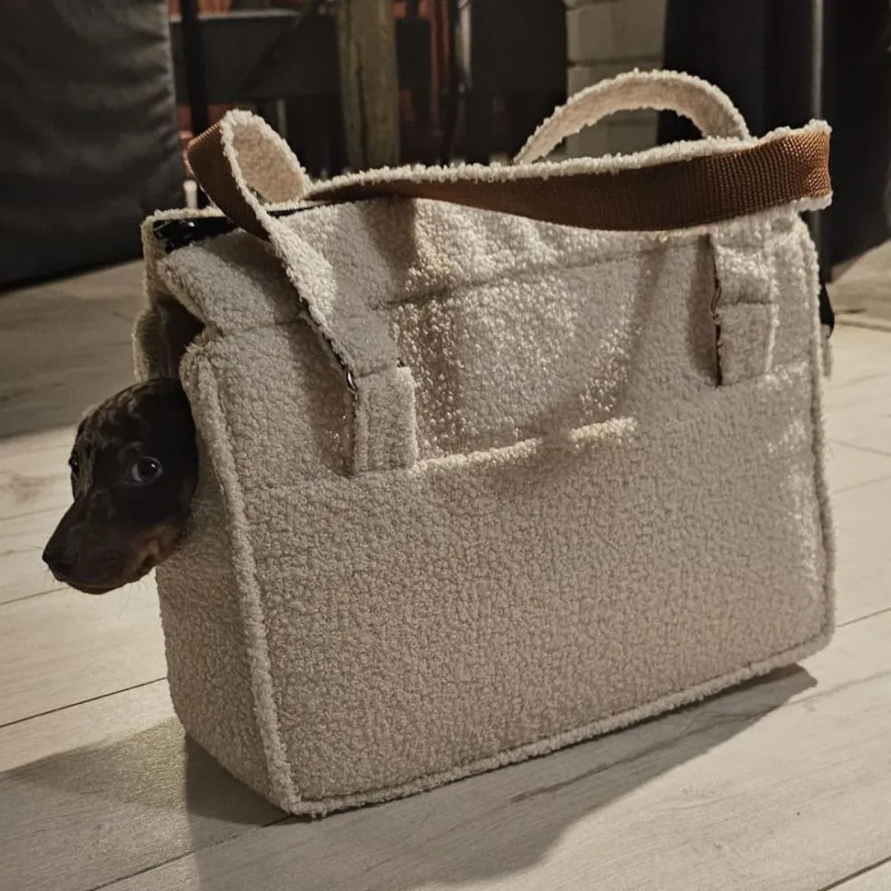 Stylish cream teddy fabric handbag with soft lining, brown handles and a practical front pocket – perfect for cosy autumn and winter outings.