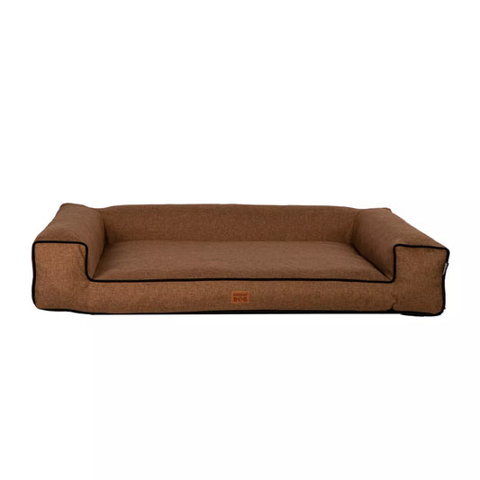 Brown dog bed with raised sides, black trim — stylish and supportive pet bedding for comfort and modern interiors