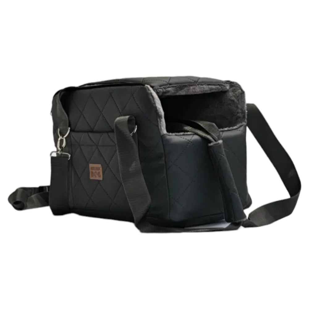 Graphite quilted dog travel bag with brown shoulder straps and soft plush interior — a stylish and secure pet carrier for small breeds.