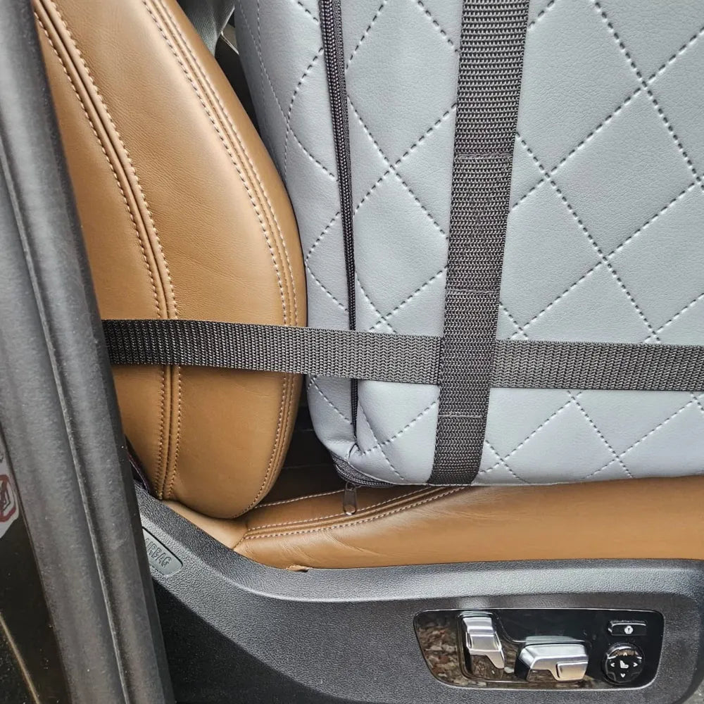 Grey quilted dog car seat cover ; includes adjustable securing straps and fits standard car seats — a protective travel accessory for pet owners.