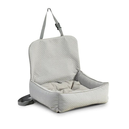 A soft, grey upholstered dog car seat with raised backrest and safety straps, designed for secure and comfortable travel in vehicles.