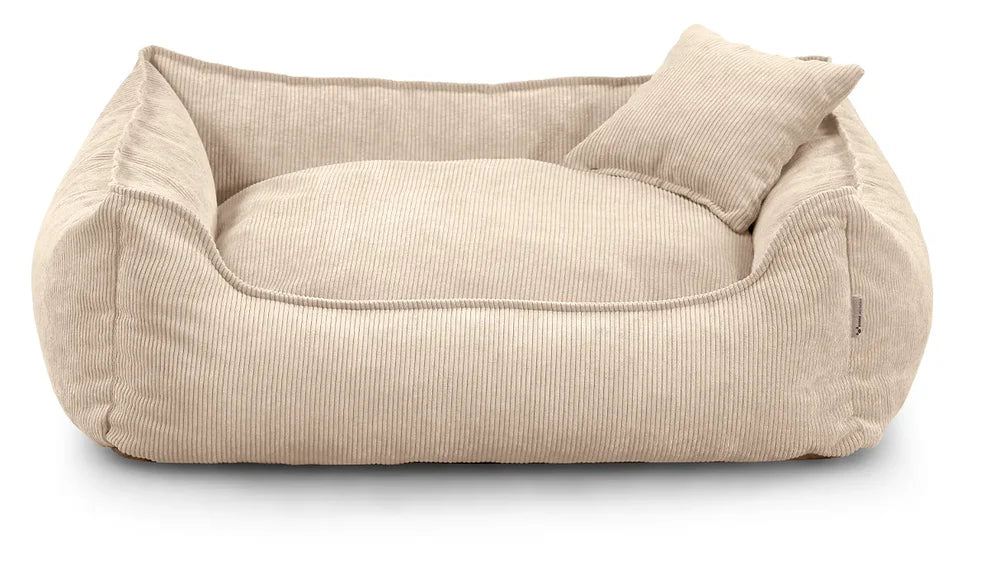 Close-up of Lucky dog bed in cream corduroy fabric, showing zippered cushion and durable stitching