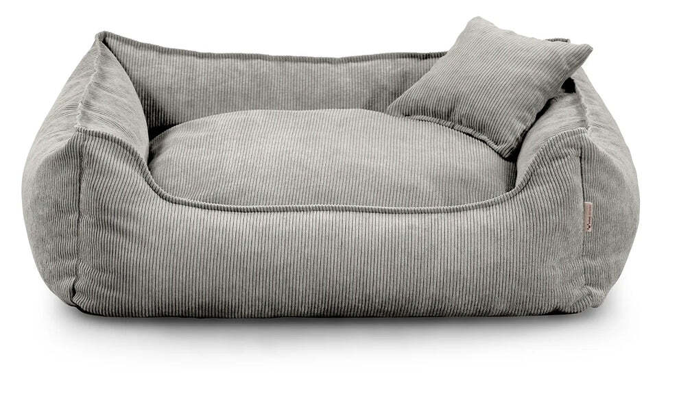 Close-up of Lucky dog bed in light grey corduroy fabric, showing zippered cushion and durable stitching