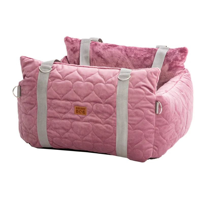 Pink quilted pet car seat and carrier from Golden Dog, featuring cosy interior padding, webbed handles, and headrest strap for secure travel with small dogs.