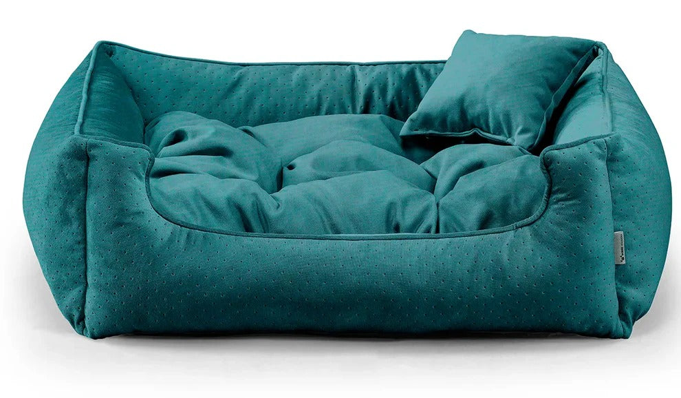 Close-up of Relax Bless dog bed in emerald green fabric.