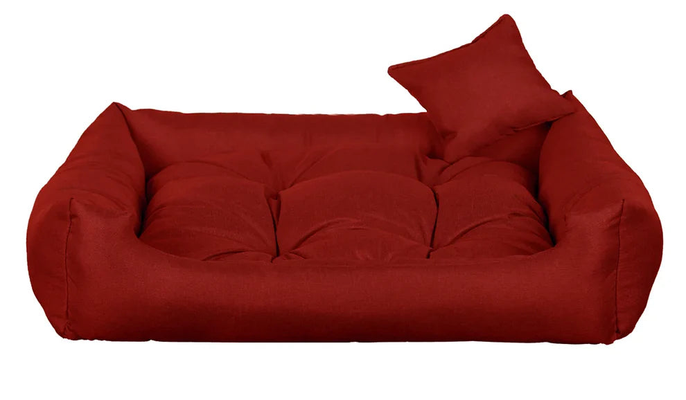 Red dog bed with thick cushion and raised sides, made from water-resistant, scratch-resistant upholstery — Sleepy Cora model for dogs of all sizes