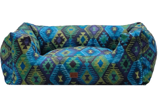 Sofa-style dog bed with aztec pattern  featuring raised sides for comfort and decorative elegance