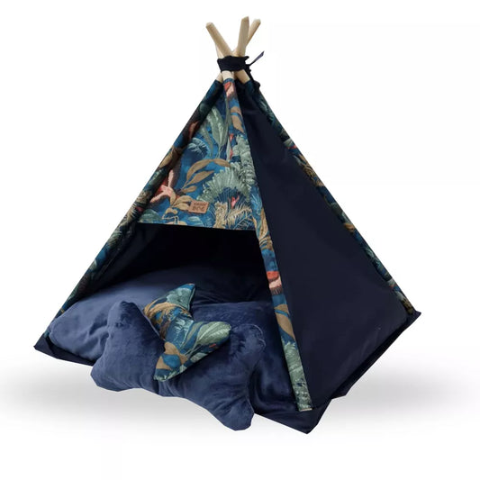 Tipi-style dog bed with dark birds patterned fabric, featuring a soft blue cushion and bone-shaped pillow — cosy tent retreat for pets with decorative charm